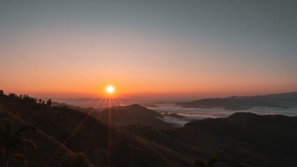 Fototapeta na wymiar sunrise over a mountain sea of fog Doi chang chiangrai Thailand