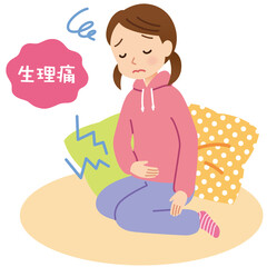 生理痛に苦しむ女の子　腹痛　室内で休む