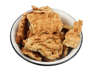 Freshly baked cake layers in a metal bow isolated