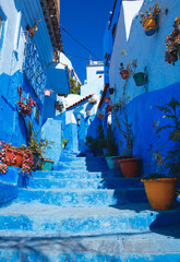 Fototapeta na wymiar Blue street in Chefchaouen in Morocco