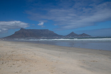 Fototapeta na wymiar The city of Cape Town below Table mountain seen from Milnerton beach