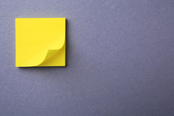 Blank paper note on color background, top view. Space for text