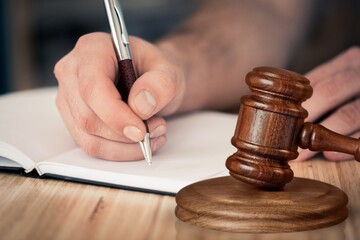 Lawyer office worker with wooden hammer and document