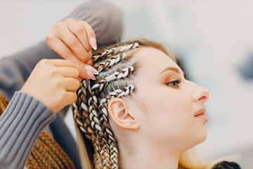 Hairstylist braided afro braids dreadlocks kanekalon pigtails hair with jewelry bijouterie decoration - obrazy, fototapety, plakaty