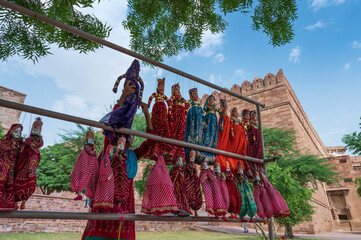 Traditional King and queen, called Raja Rani, handmade puppets or Katputli Sets are hanging for...