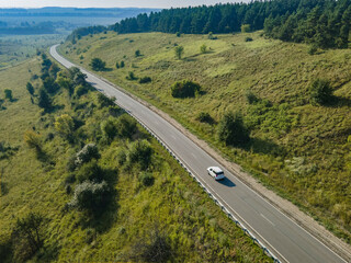 Car on road in the summer time nature from air . View from a drone. Aerial view. - 574166065