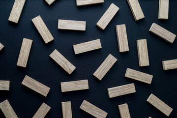 Naklejka na ściany i meble wooden blocks on a dark background, text to write. Jenga blocks.