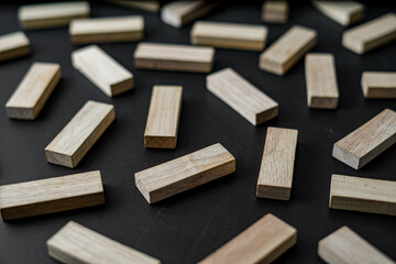Naklejka na ściany i meble wooden blocks on a dark background, text to write. Jenga blocks.