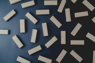 wooden blocks on a dark background, text to write. Jenga blocks.