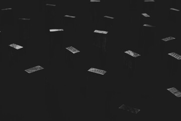 black and white abstract of wooden blocks standing in the dark sky. hike of everything