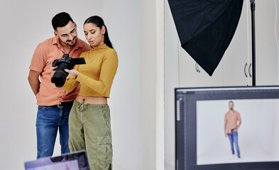 Teamwork, photographer and startup people with camera in studio set for shoot, magazine project or...