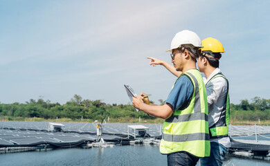 Team of engineers wearing a uniform inspect and check solar cell panel, solar cell is smart ecology energy sunlight alternative power factory concept.