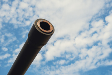 Tower of armored personnel carrier or tank. Heavy weapons of war, sky background. Army equipment...