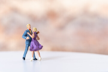 Miniature Couple dancing on dance floor , International dance day concept