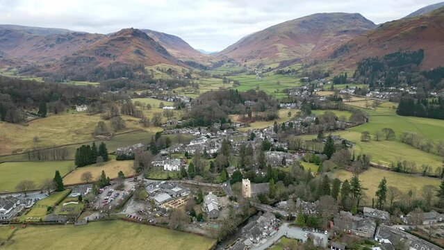 Cinematic cumbrian village landscape, Aerial view of Grassmere, village, town in the English Lake District, UK.