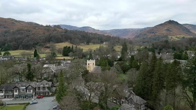4k Cinematic cumbrian aerial village landscape, Aerial view of Grassmere, village, town in the English Lake District, UK.