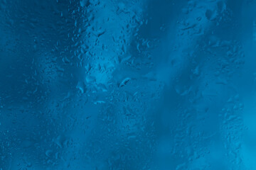 Fototapeta na wymiar Drops of rain water droplets on glass