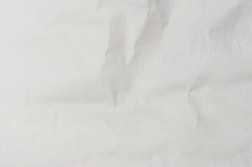 Wrinkled or crumpled white stencil paper or tissue used for background texture
