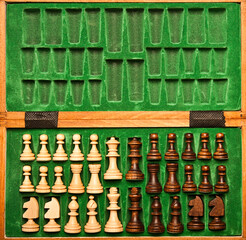 set of chess pieces into the box