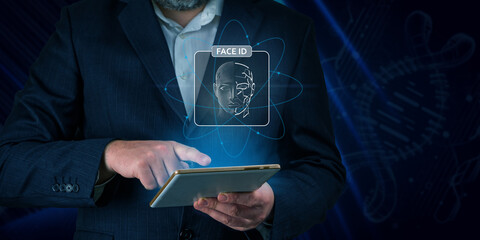 Man using tablet with face id scan and modern technology. Login using Face id and AI