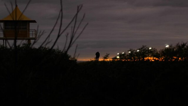Person on Sand Dune Sunset on Beach Hut with Sunset Photographer on Beach