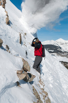 Male ski patroller doing avalanche control work at the Crested Butte Ski Resort, Crested Butte, Colorado.