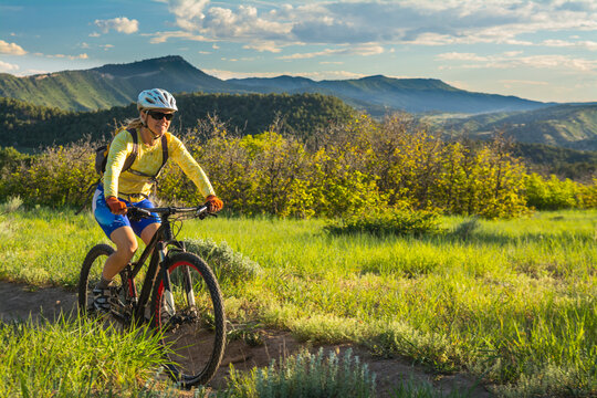 A woman mountain biking on the Horse Gulch Trail System, Durango, Colorado