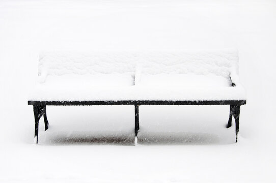 Snow covered Park Bench