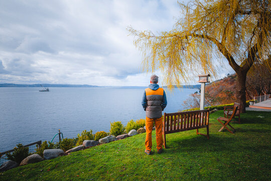 A man is standing near Puget Sound