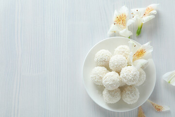 Concept of tasty sweets, coconut candies, space for text