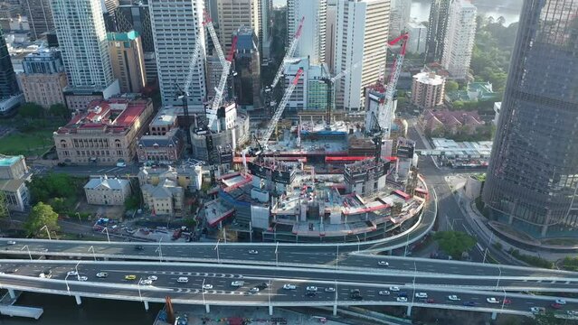 Queens Wharf development inBrisbane, captured by an awe-inspiring aerial shot. The image showcases multiple cranes at work, constructing a mega-structure that will soon stand tall in the city skyline.
