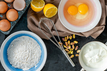 Ingredients for lemon and pistachio cake - overhead view