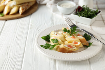 Concept of tasty food, thin pancakes with filling, space for text