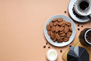 Concept of tasty snack for hot drink - cookies in the shape of coffee seeds