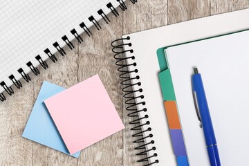 Blank Sticky note with stationery items on the desk