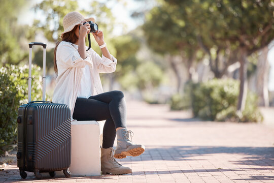 Travel, photography and woman with suitcase and camera in city for weekend, holiday and vacation. Traveling, journey and girl photographer in urban town with luggage for adventure, tourism and relax