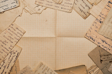 Old handwritten postal letters and a blank old sheet of paper