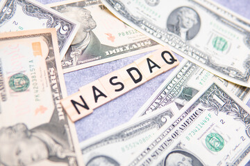 Nasdaq inscription next to US dollars. The Nasdaq is an American stock market index