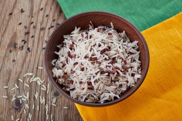 boiled rice in a plate, on a yellow-green napkin