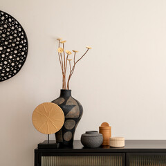 Minimalist composition of living room interior with copy space, black commode, vase with dried...
