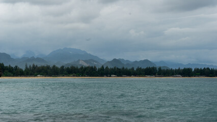 Blue sea and tropical island. holiday and vacation concept. Beautiful view of beach landscape at eky momong beach in Banda Aceh, Indonesia.