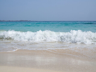 Fototapeta na wymiar beach with white sand and waves
