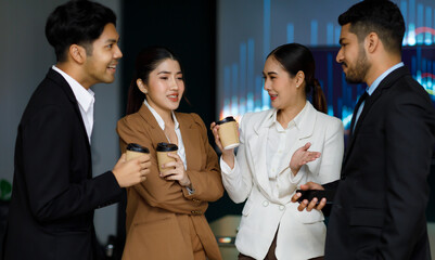 Millennial Asian Indian multinational cheerful professional successful male businessmen female businesswomen employee colleagues in formal business suit taking coffee break relaxing talking together