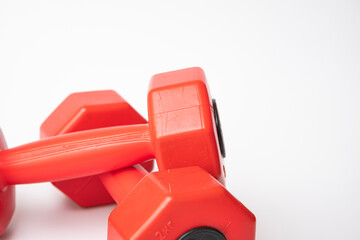 Red dumbbell for fitness isolated on white background