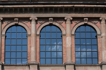 Huge windows of an old building.