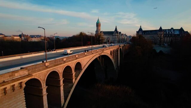 Luxembourg Adolf Bridge and city skyline, spuerkees tower airplane. 4k 24fps. Tripod. 