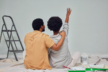 Painting, wall or black couple planning DIY, home renovation or house remodel together on floor....