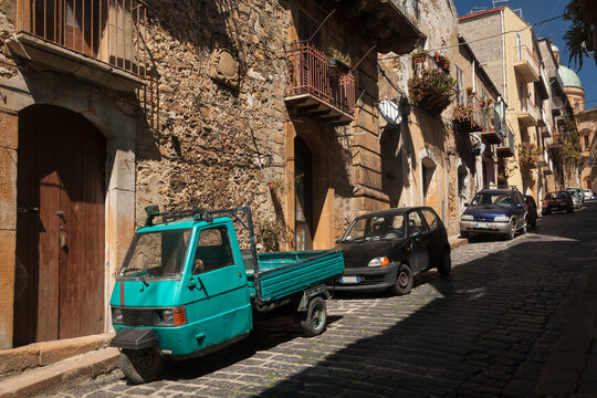 Old three-wheeled motorcycle parked in Piazza Armerina, Sicily