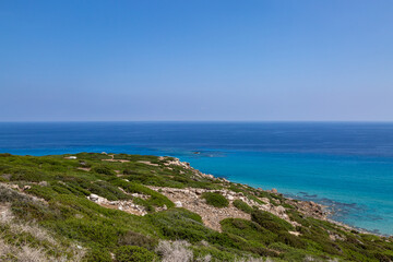 Fototapeta na wymiar The turquoise Mediterranean Sea viewed from along the Karpaz Peninsula on the Island of Cyprus