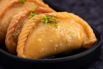 Gujia Also Called Gujiya, Pirukiya, Pirukia, Pedakiya, Karanji, Basundi Or Gughra Stuffed With Mawa, Khoya, Chasni, Mava, Khoa - Indian Sweet Dumpling Enjoyed On Deepawali, Teez, Holi, Diwali And Teej